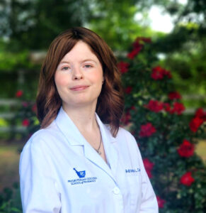 Headshot of Adrianna Cody '24 in PCSP White Coat